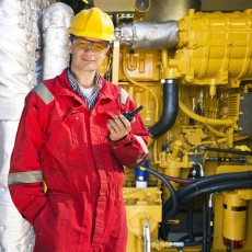a hydraulics engineer, wearing a red jumpsuit